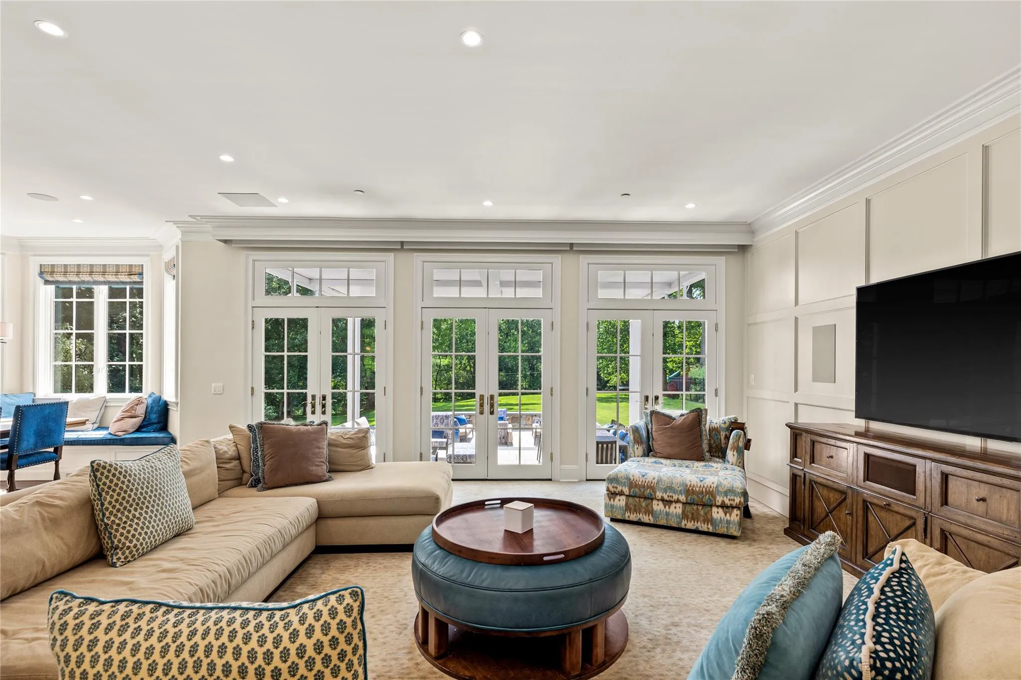 Family Room off the Kitchen featuring french doors to the covered patio Family Room off the Kitchen featuring french doors to the covered patio