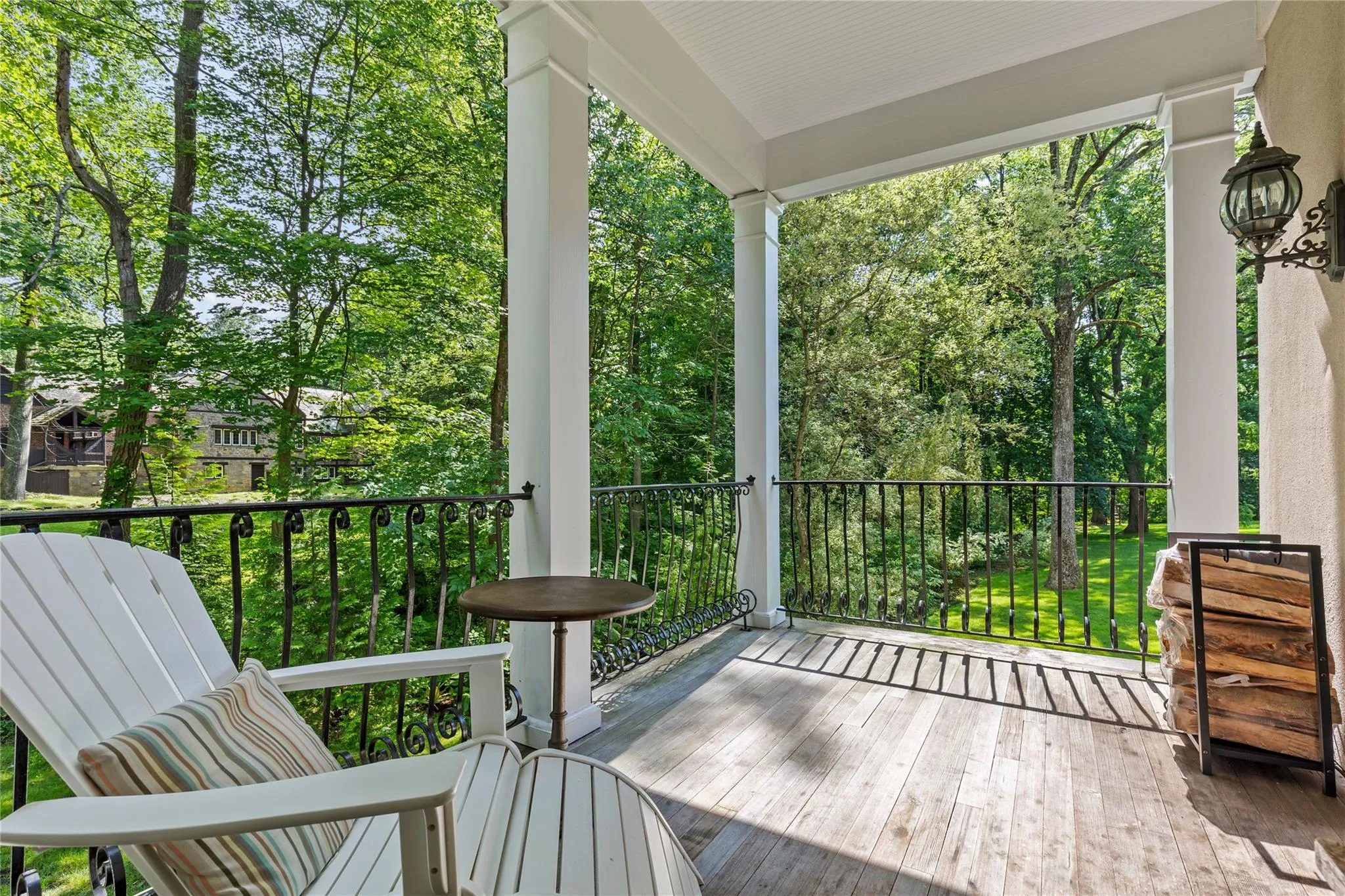 Wooden porch off living room with view of the rear property Wooden porch off living room with view of the rear property
