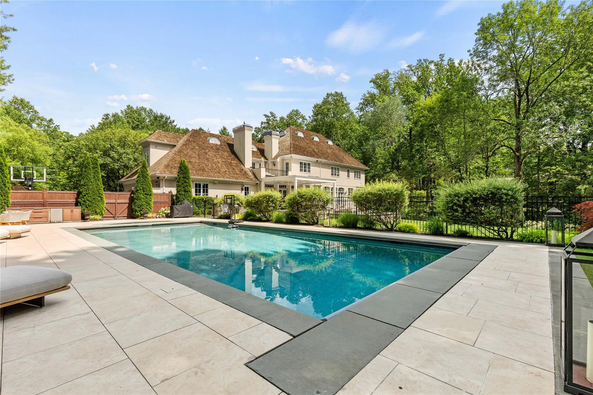 Another view of the pool and the rear of the house Another view of the pool and the rear of the house