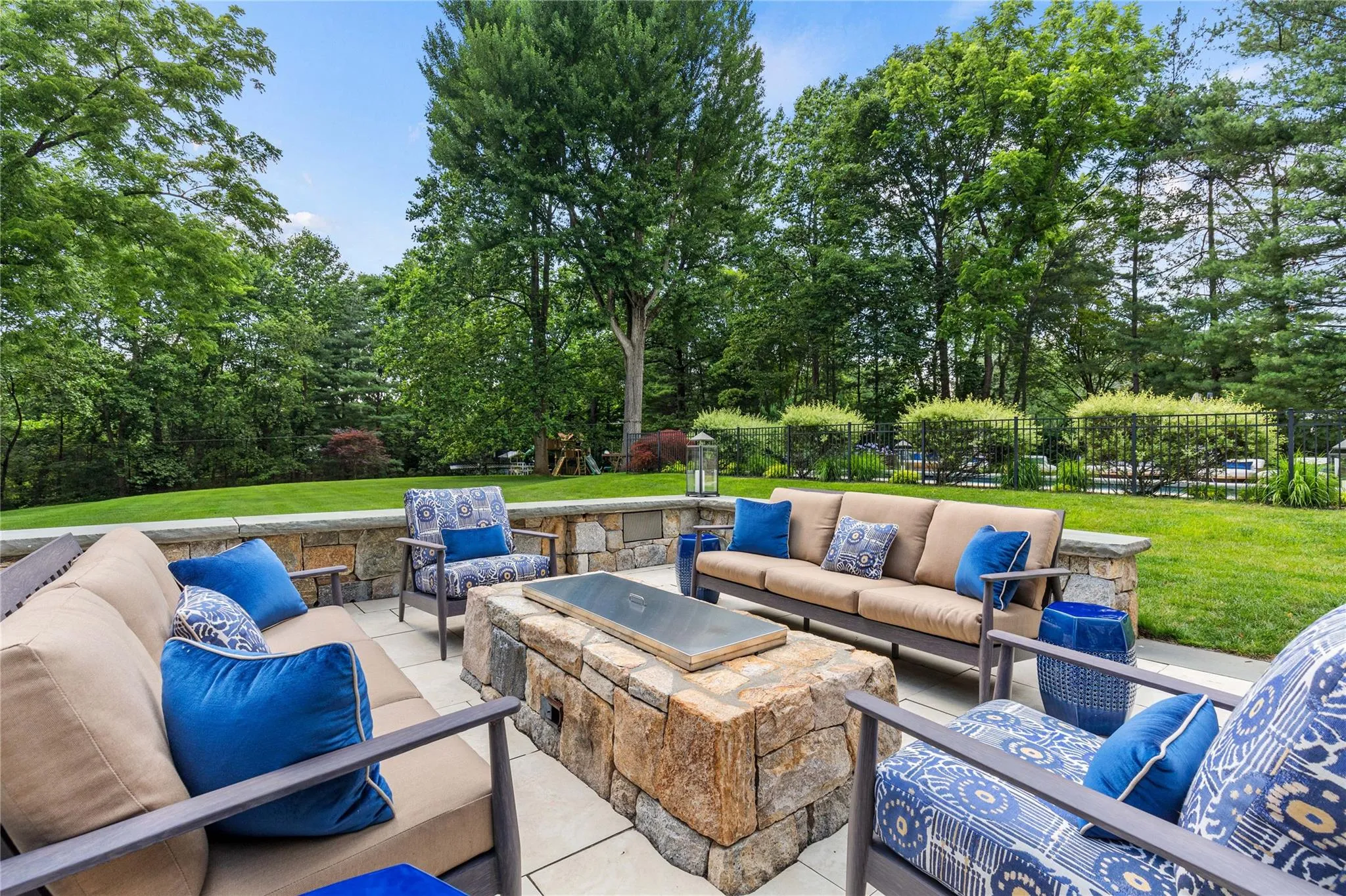 Fenced backyard with outdoor lounge area, view of and view of the backyard Fenced backyard with outdoor lounge area, view of and view of the backyard