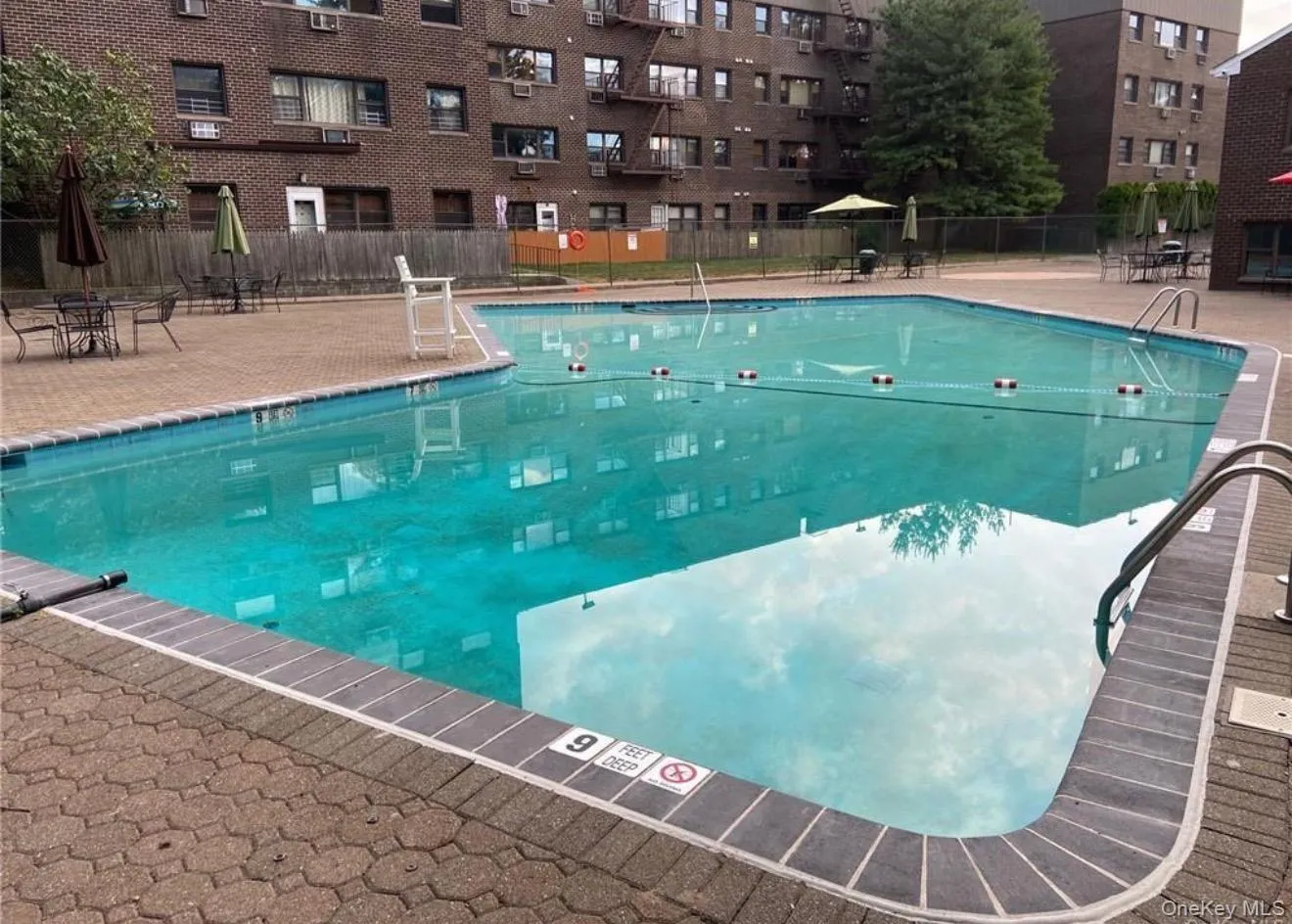 Community pool with a patio Community pool with a patio