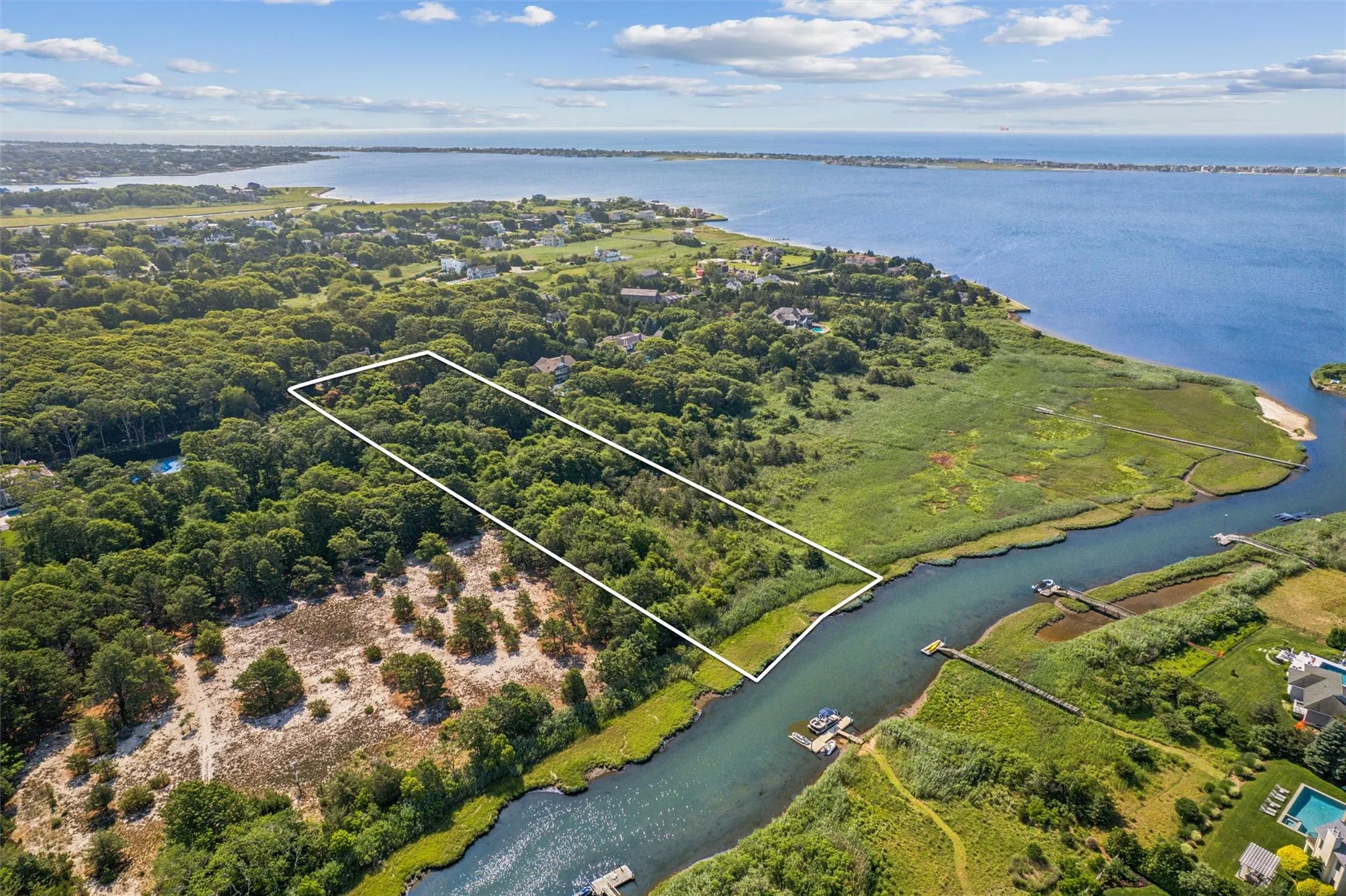Aerial view of property's location featuring a large body of water and property boundaries highlighted Aerial view of property's location featuring a large body of water and property boundaries highlighted