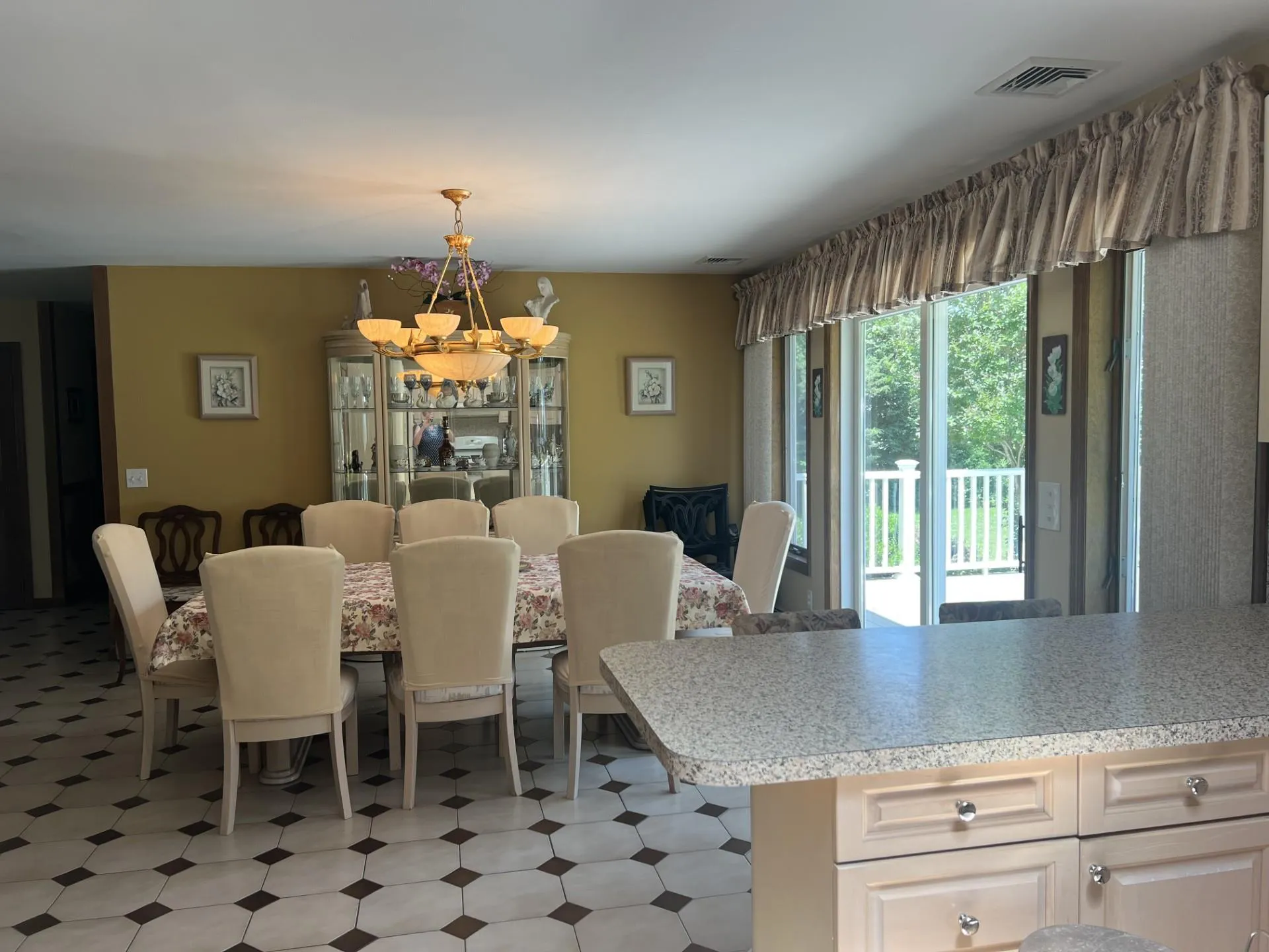 Dining room with sliding glass doors that lead to a deck. Dining room with sliding glass doors that lead to a deck.