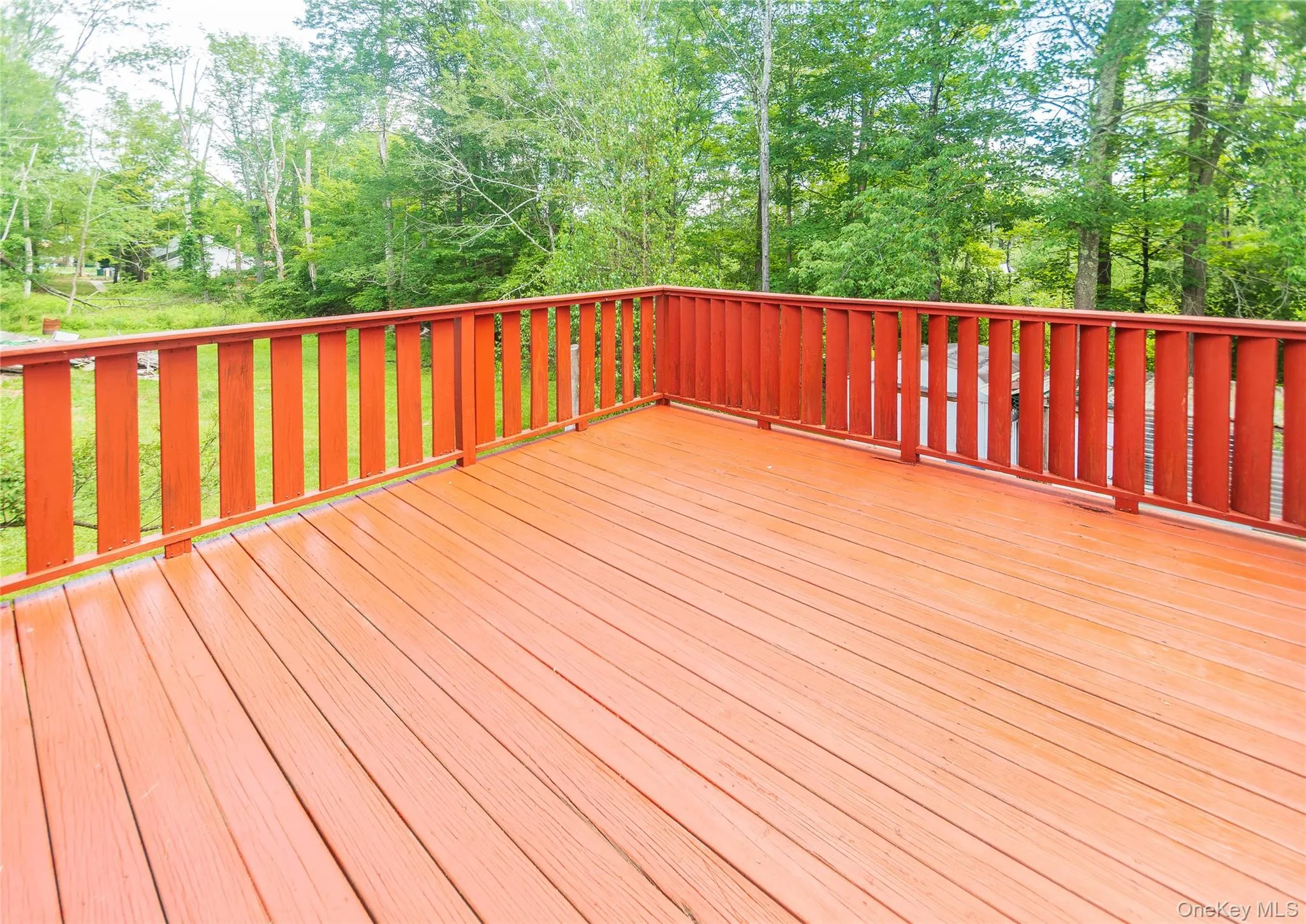 Deck with view of scattered trees Deck with view of scattered trees