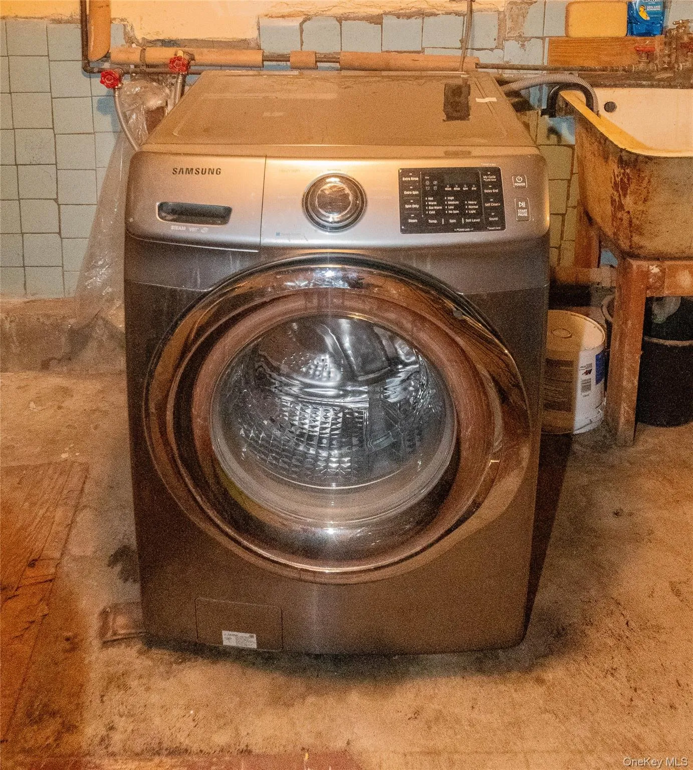 Laundry area washer hookup and slop sink Laundry area washer hookup and slop sink