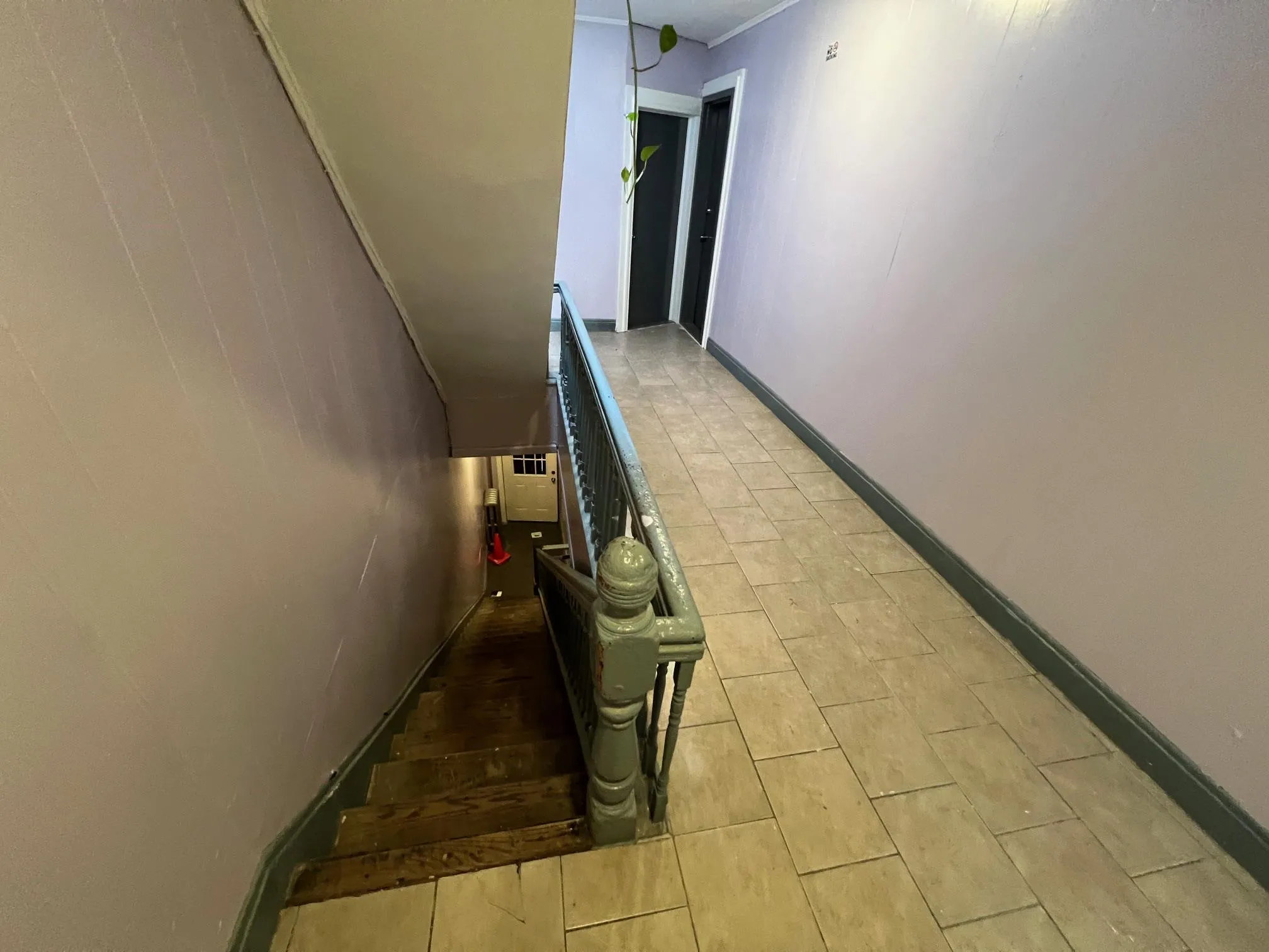 Corridor featuring light tile patterned floors Corridor featuring light tile patterned floors