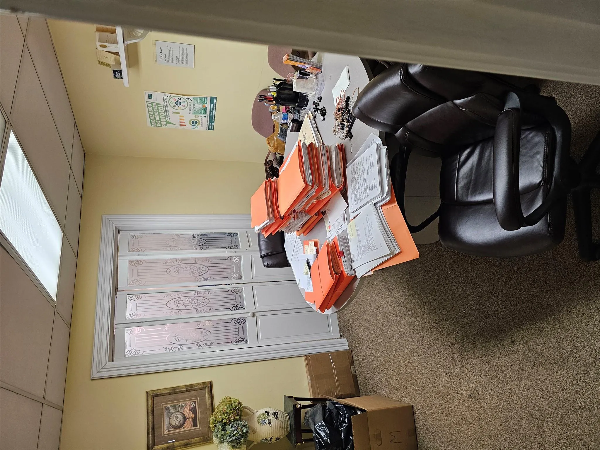 Home office featuring a drop ceiling and carpet Home office featuring a drop ceiling and carpet