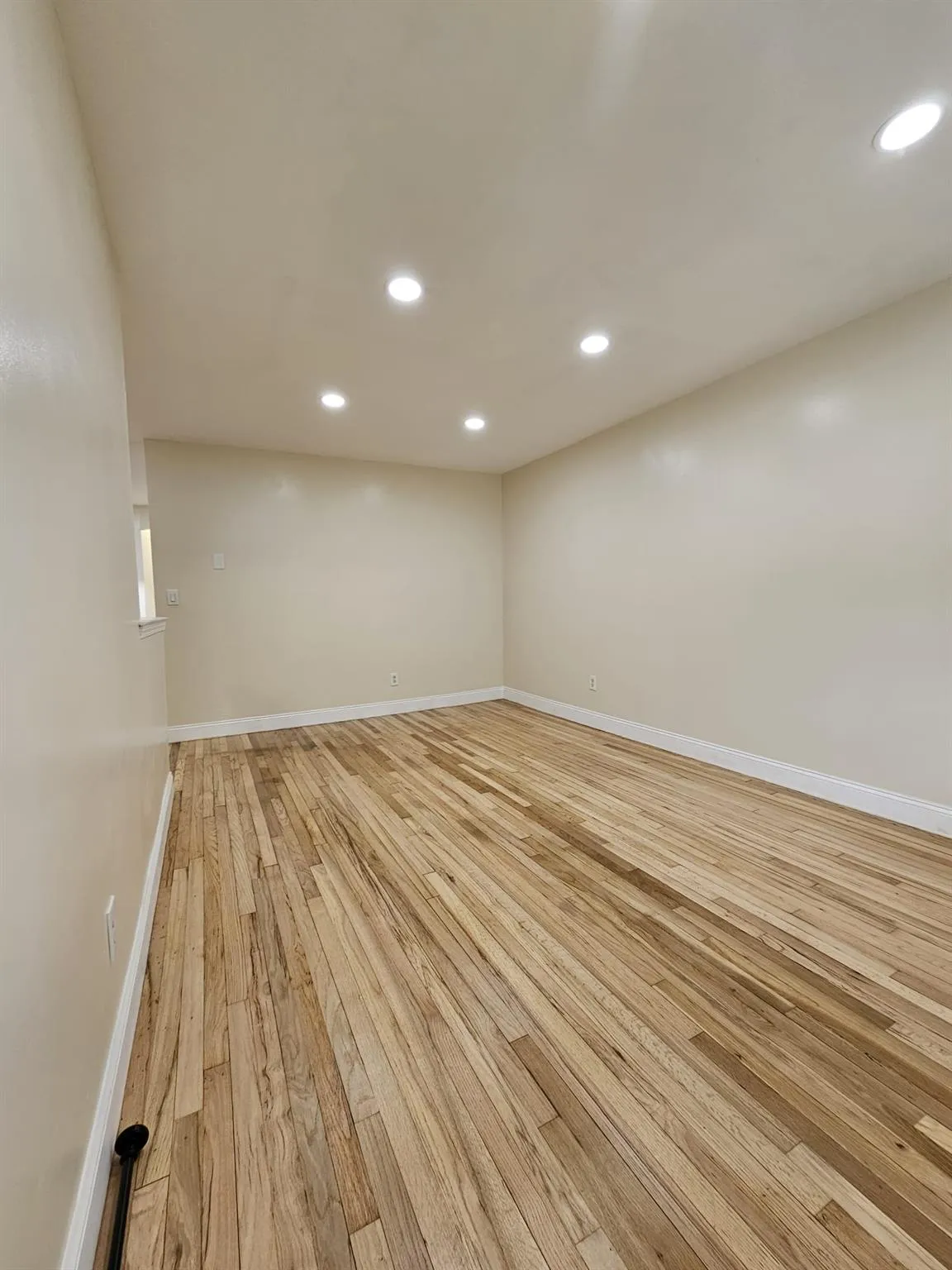 Unfurnished room featuring light wood-style floors and recessed lighting Unfurnished room featuring light wood-style floors and recessed lighting