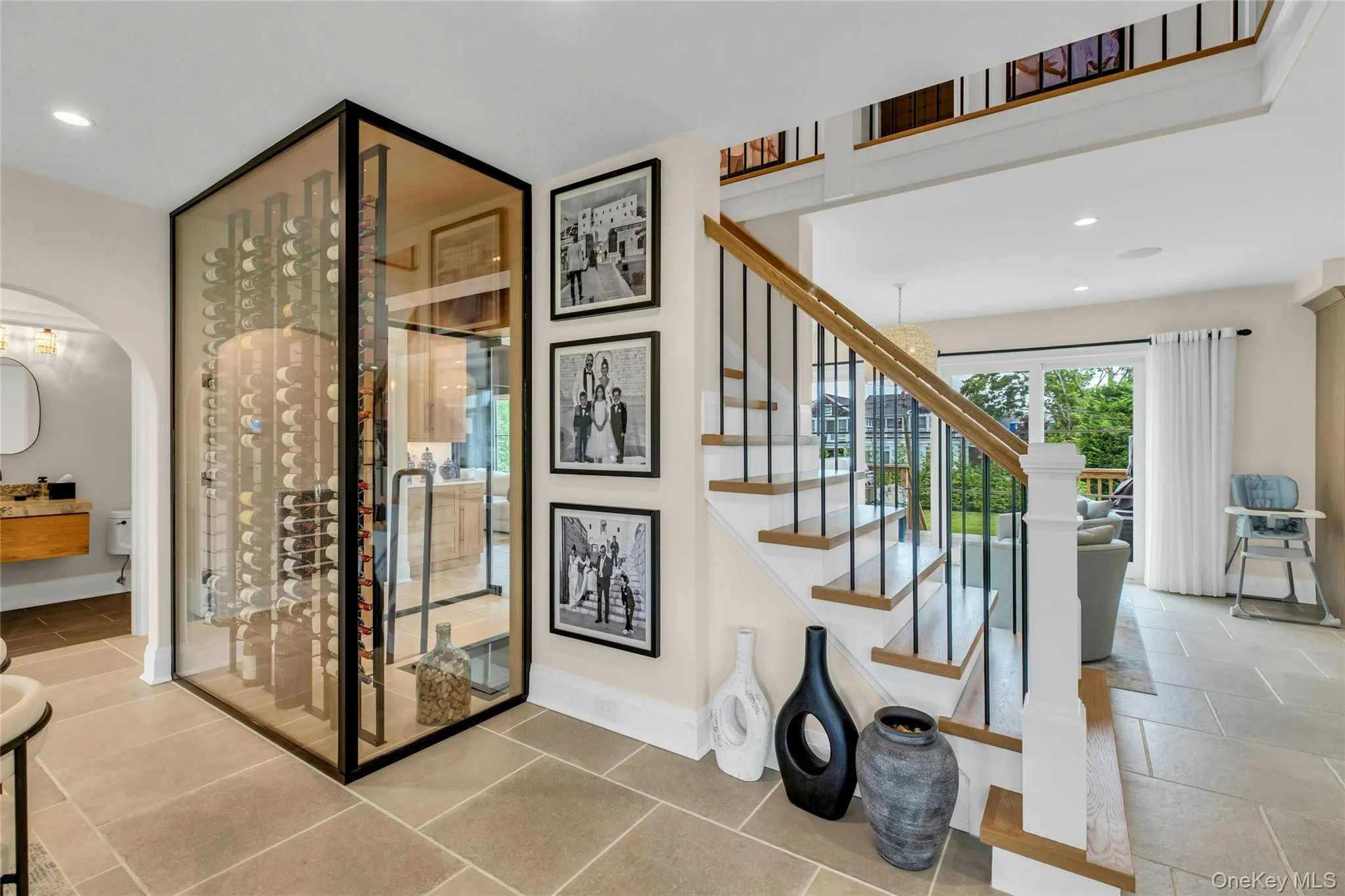 Stairs featuring arched walkways and recessed lighting Stairs featuring arched walkways and recessed lighting
