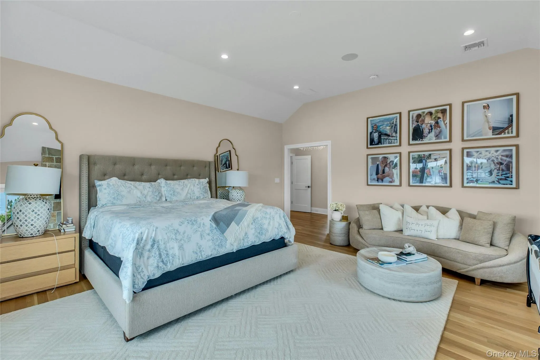 Bedroom featuring vaulted ceiling, wood finished floors, and recessed lighting Bedroom featuring vaulted ceiling, wood finished floors, and recessed lighting