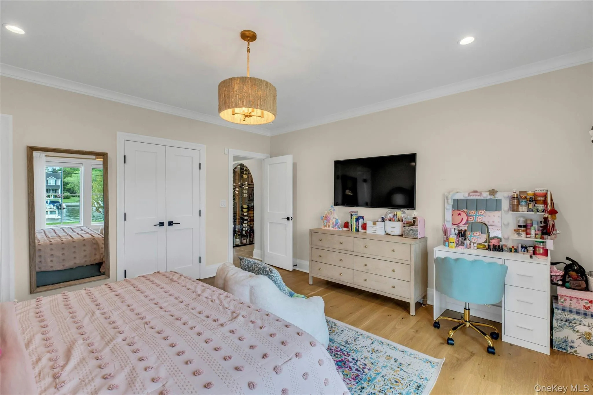 Bedroom featuring crown molding, wood finished floors, and recessed lighting Bedroom featuring crown molding, wood finished floors, and recessed lighting