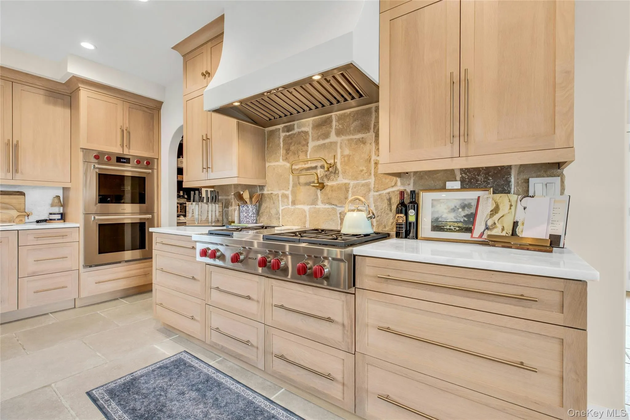 Kitchen featuring premium range hood, light brown cabinetry, stainless steel appliances, backsplash, and recessed lighting Kitchen featuring premium range hood, light brown cabinetry, stainless steel appliances, backsplash, and recessed lighting