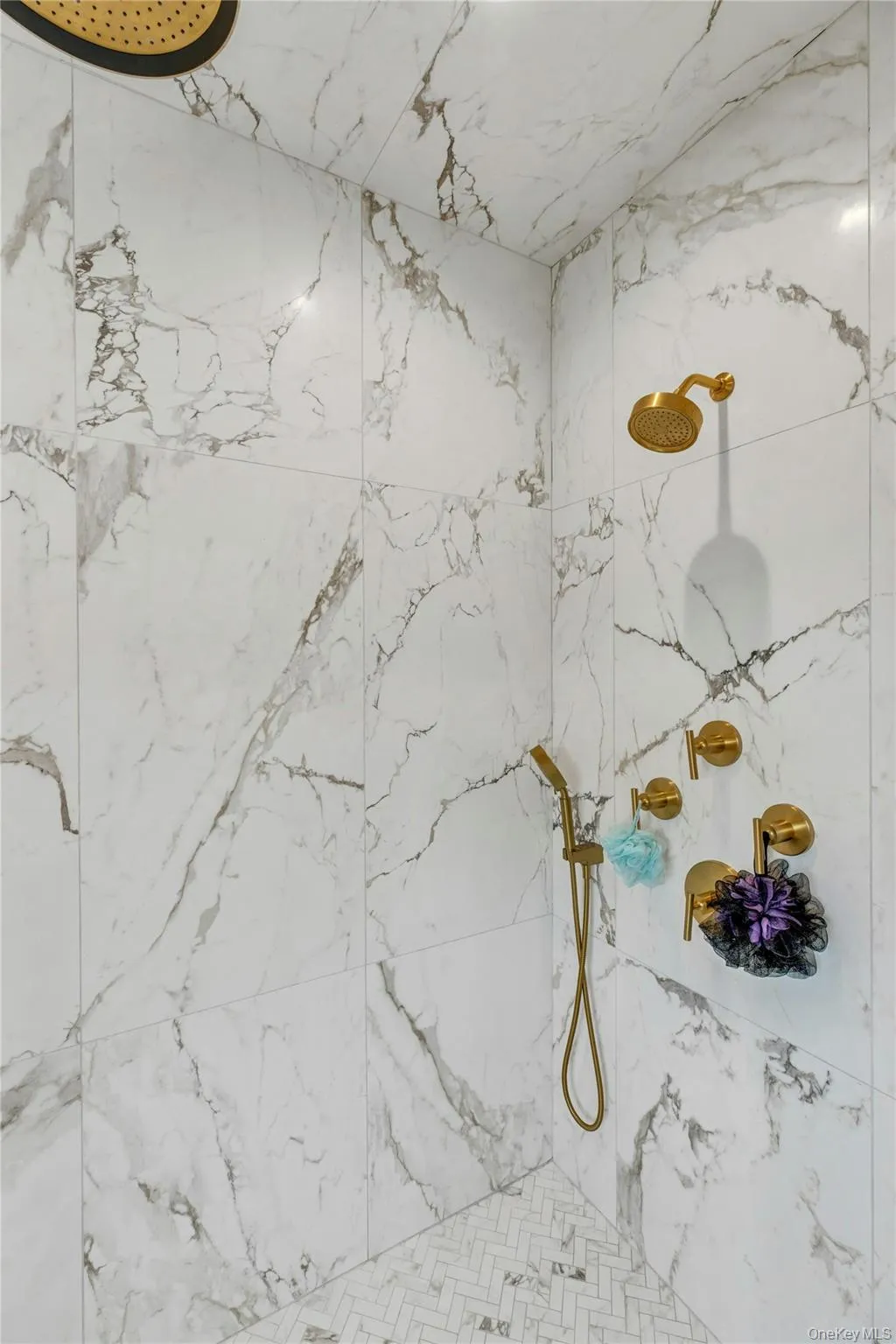 Bathroom view of a marble finish shower Bathroom view of a marble finish shower