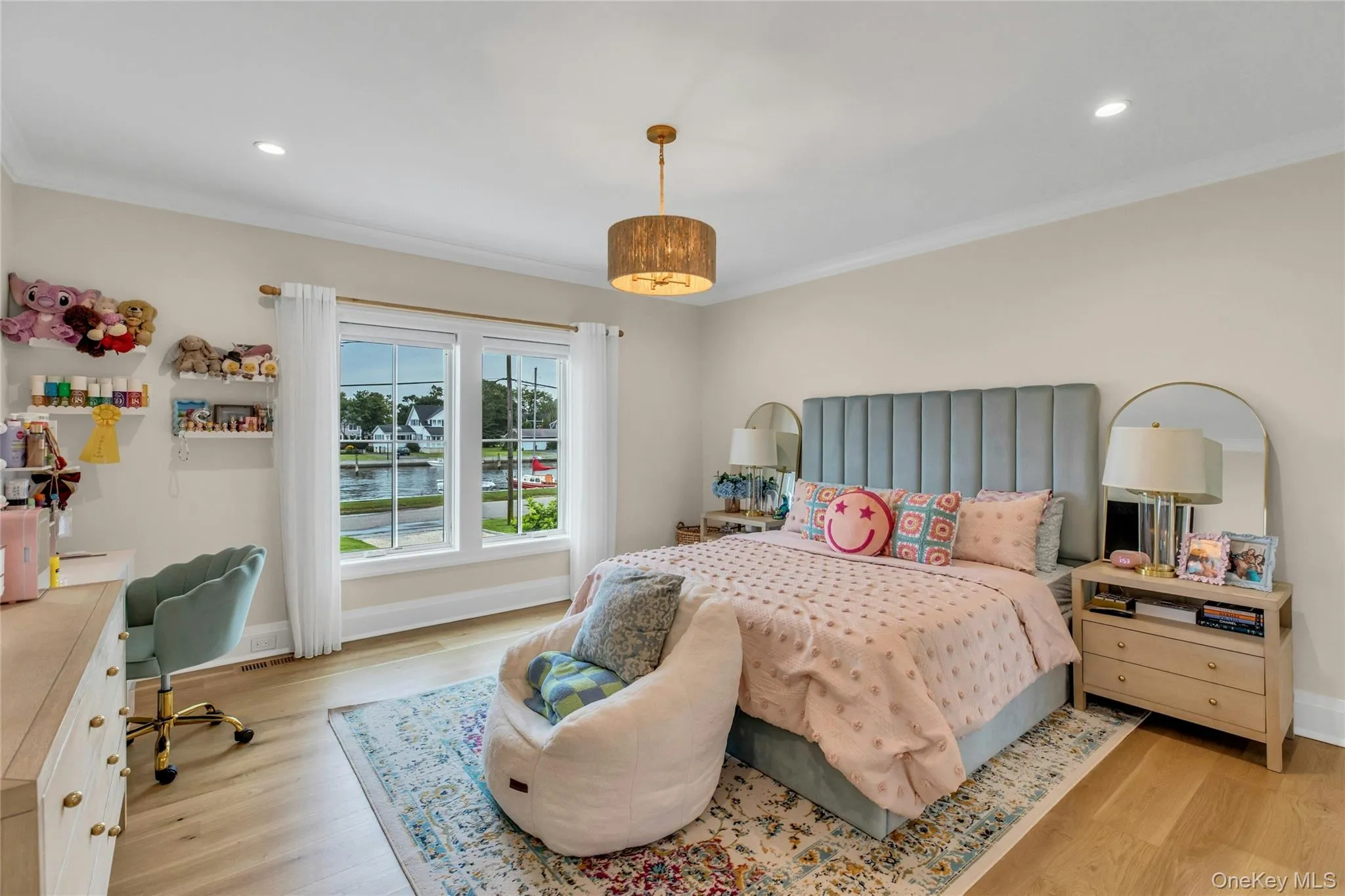 Bedroom featuring light wood-type flooring, ornamental molding, and recessed lighting Bedroom featuring light wood-type flooring, ornamental molding, and recessed lighting