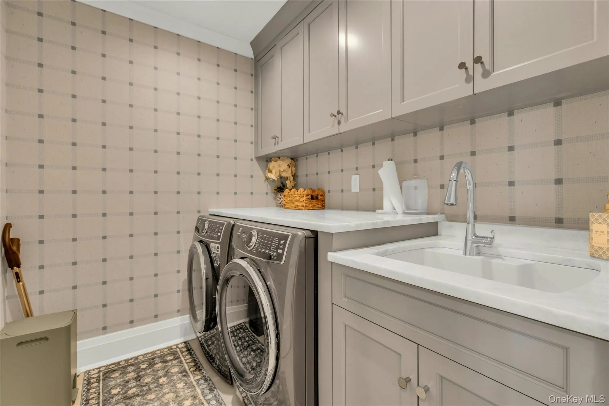 Laundry room with cabinet space and separate washer and dryer Laundry room with cabinet space and separate washer and dryer