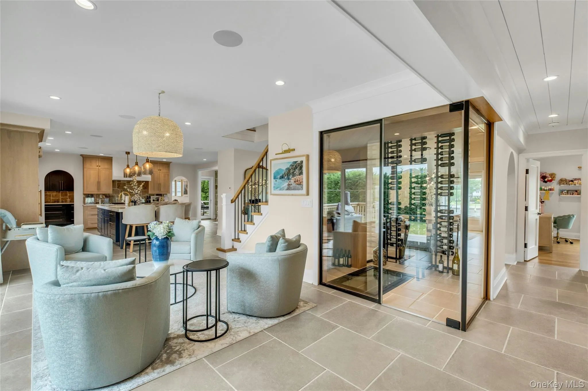 Living area with recessed lighting, stairway, a chandelier, light tile patterned floors, and ornamental molding Living area with recessed lighting, stairway, a chandelier, light tile patterned floors, and ornamental molding