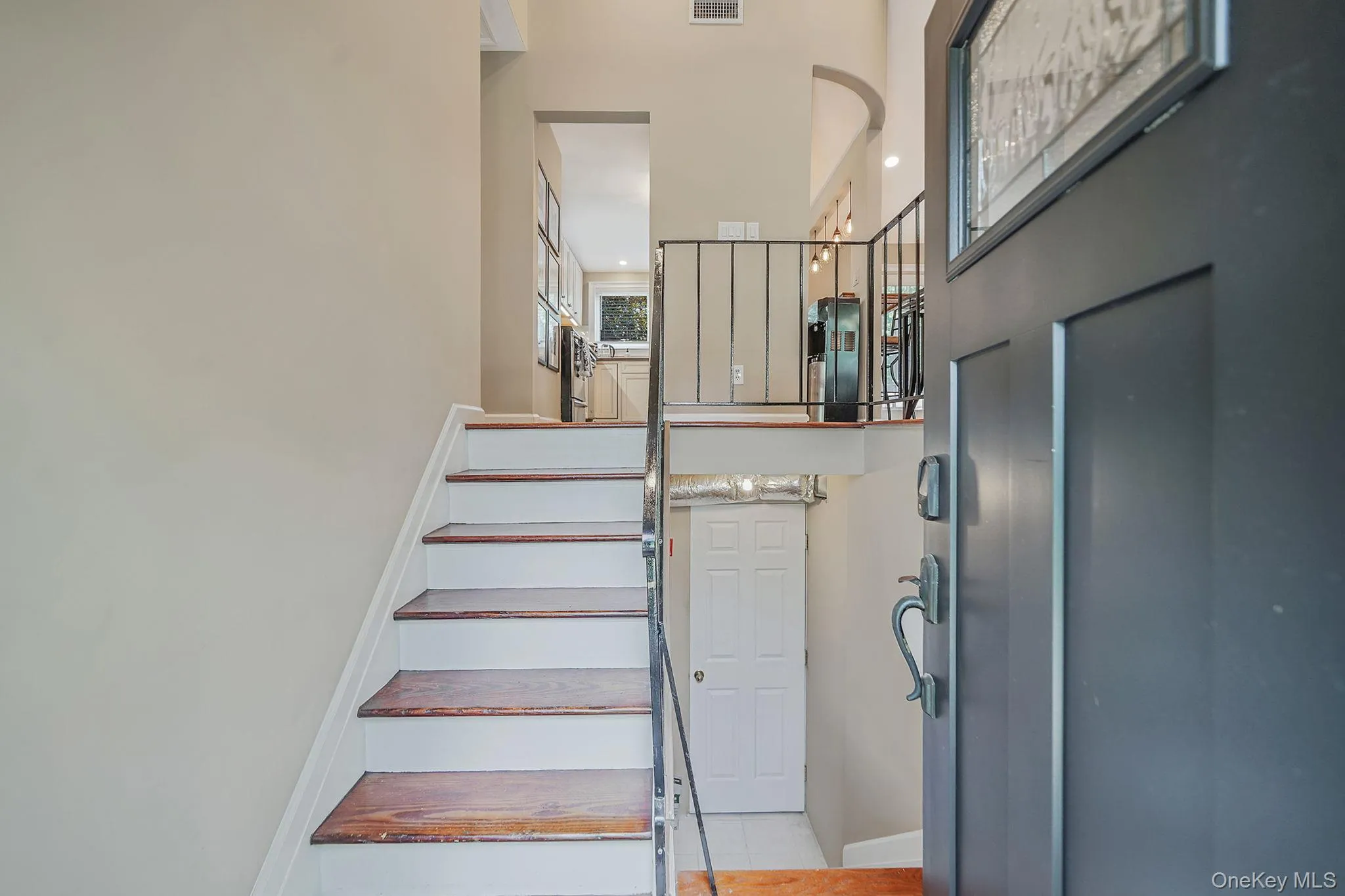 Foyer entrance with a towering ceiling and stairs Foyer entrance with a towering ceiling and stairs