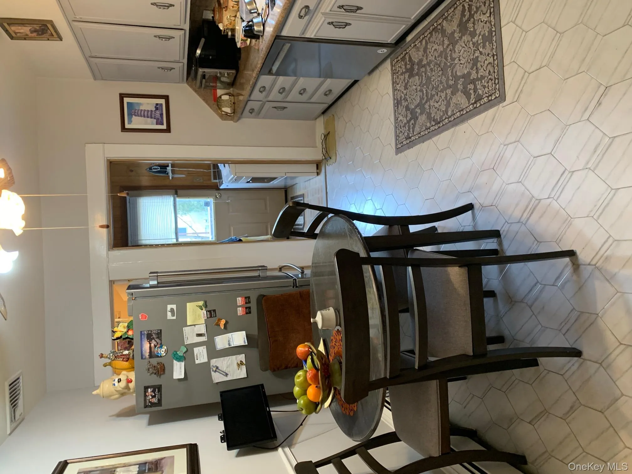 Kitchen with stove, tasteful backsplash, dishwasher, gray cabinets, and fridge Kitchen with stove, tasteful backsplash, dishwasher, gray cabinets, and fridge