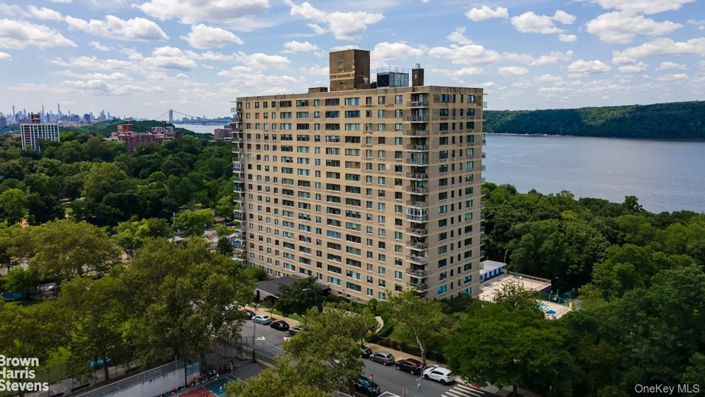 View of property featuring a water view and a city view View of property featuring a water view and a city view