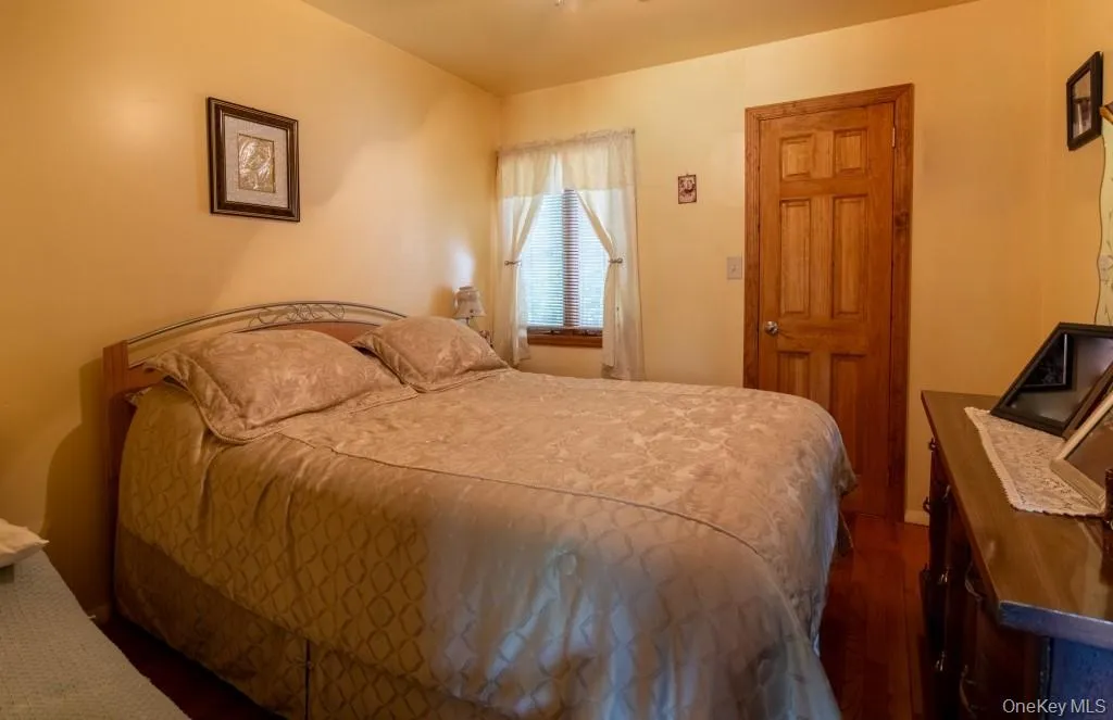 Bedroom featuring dark wood-type flooring Bedroom featuring dark wood-type flooring