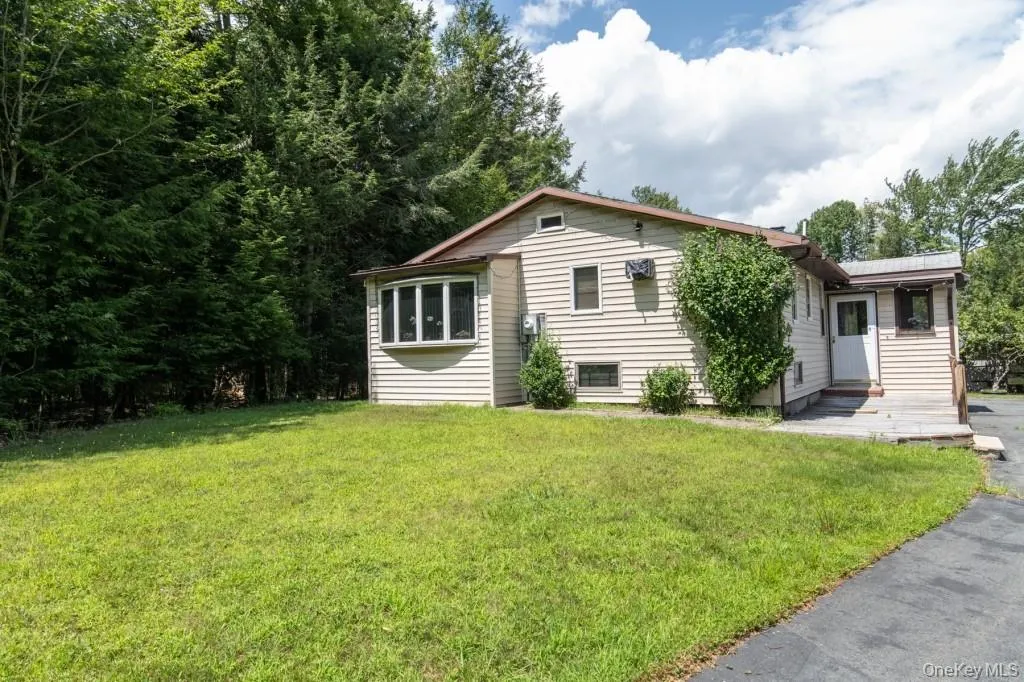 Single story home with a front yard Single story home with a front yard