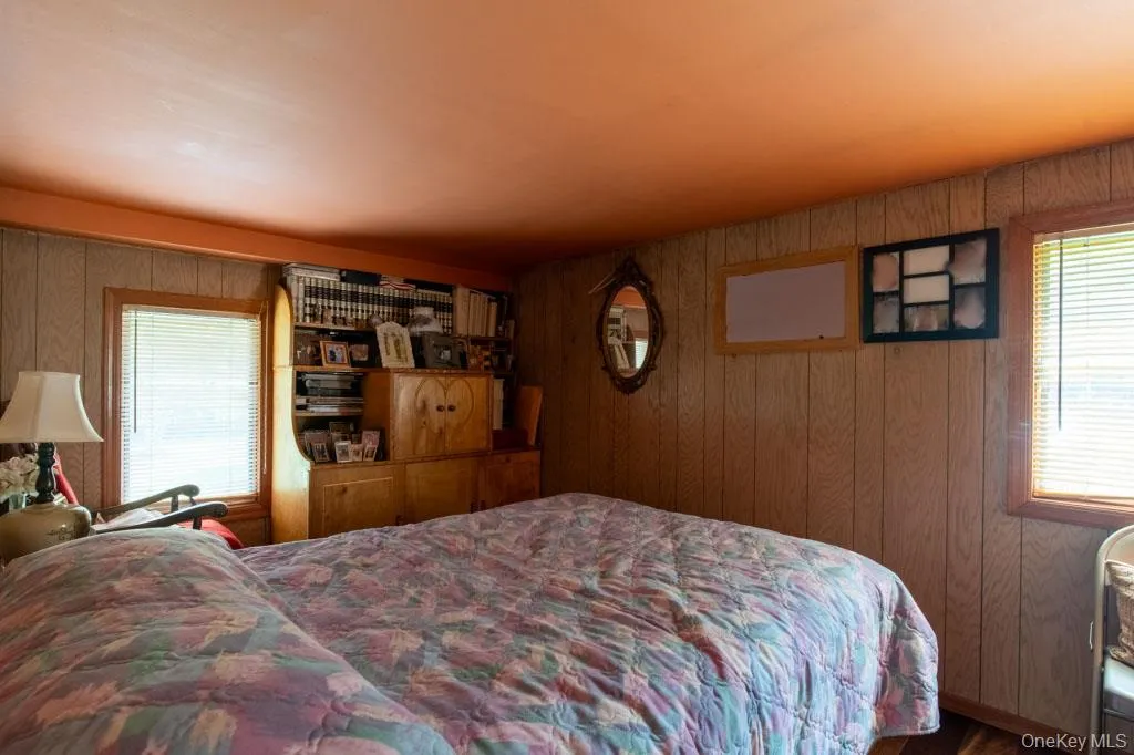 Bedroom with wood walls Bedroom with wood walls
