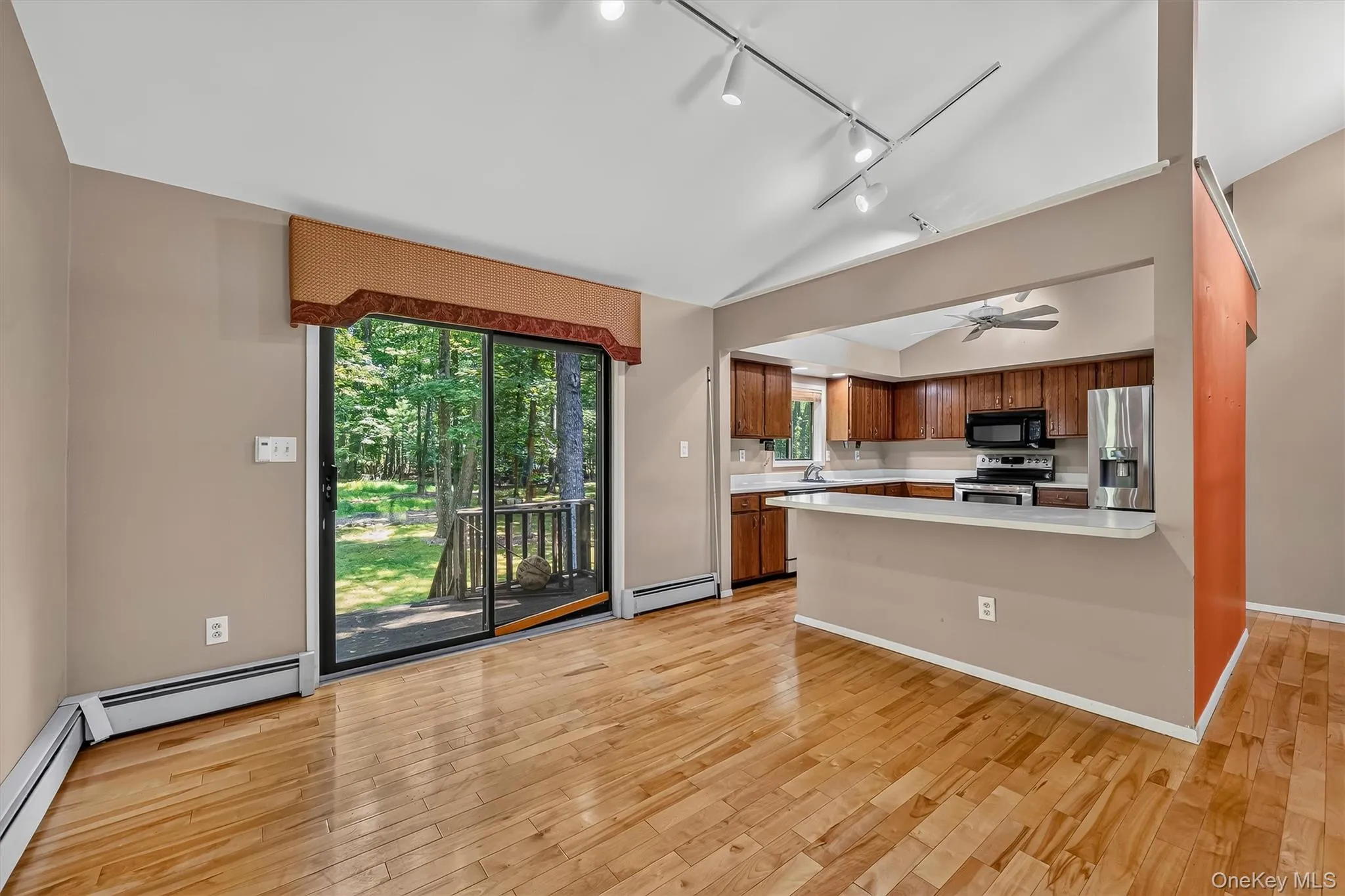 Note the slider to the deck with easy access from kitchen as well Note the slider to the deck with easy access from kitchen as well