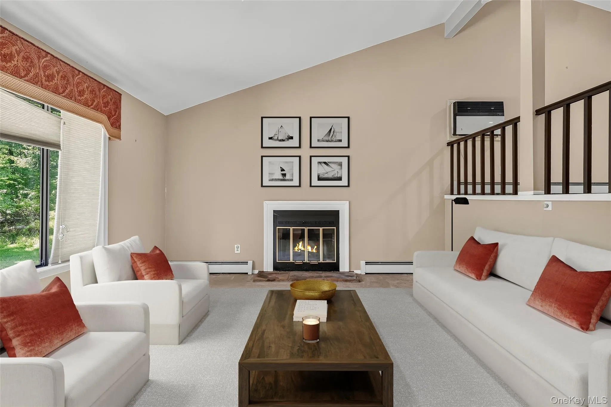 Expansive living room, with soaring ceilings, large front window, fireplace and lots of light Expansive living room, with soaring ceilings, large front window, fireplace and lots of light