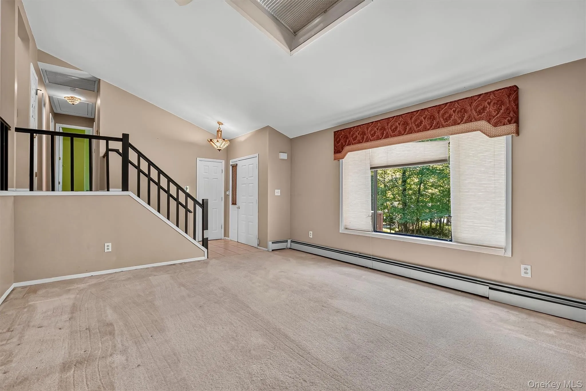 View from wall with fireplace. Note the large front window which lets so much light in View from wall with fireplace. Note the large front window which lets so much light in