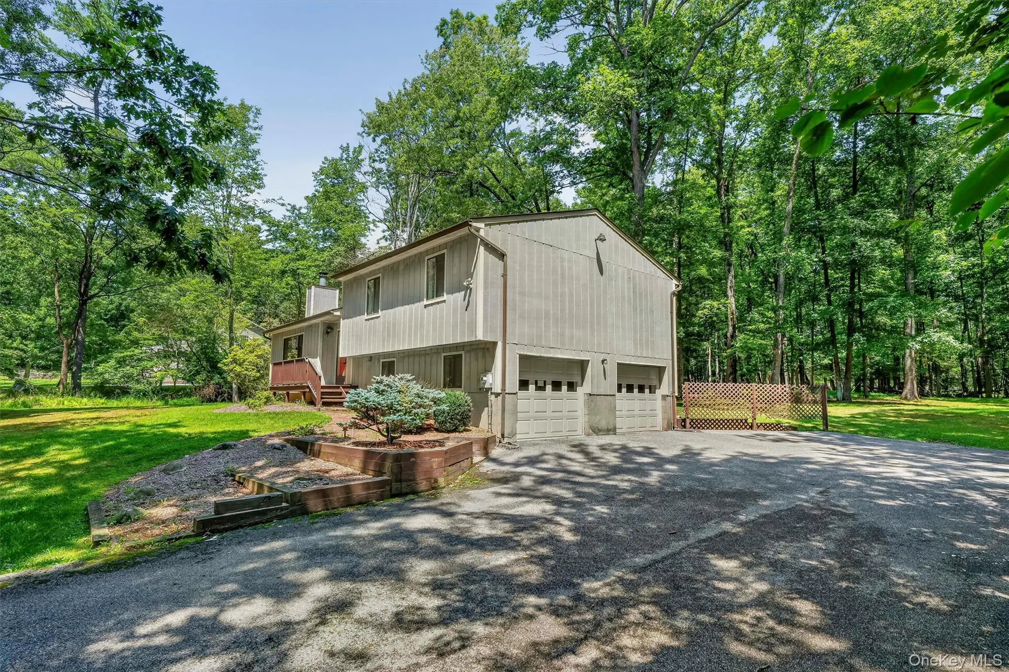 Set back from the road on over a lightly wooded acre. Note the extra wide driveway with turnaround space, which is great for company! Set back from the road on over a lightly wooded acre. Note the extra wide driveway with turnaround space, which is great for company!