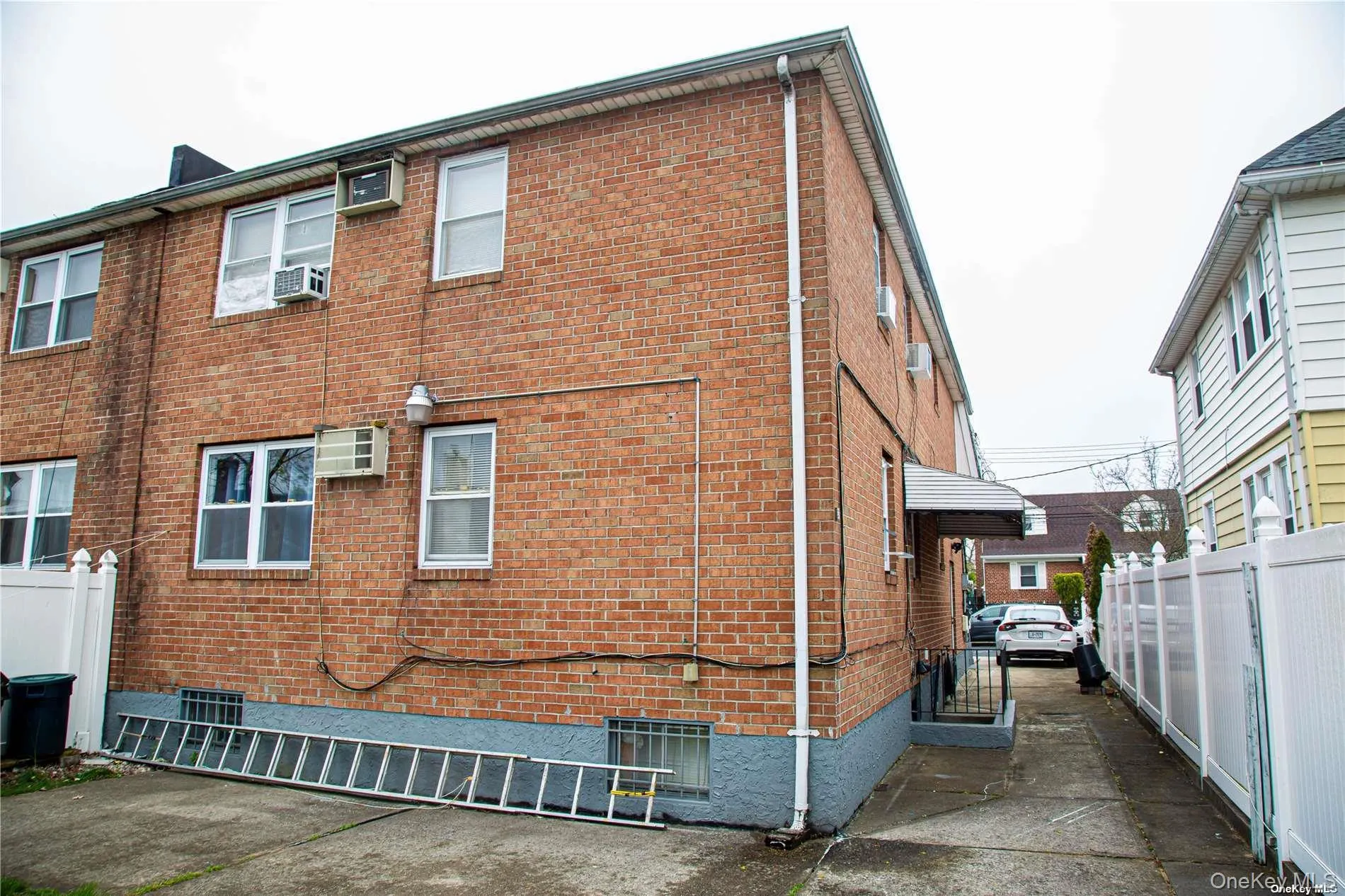 View of side of home with brick siding and cooling unit View of side of home with brick siding and cooling unit
