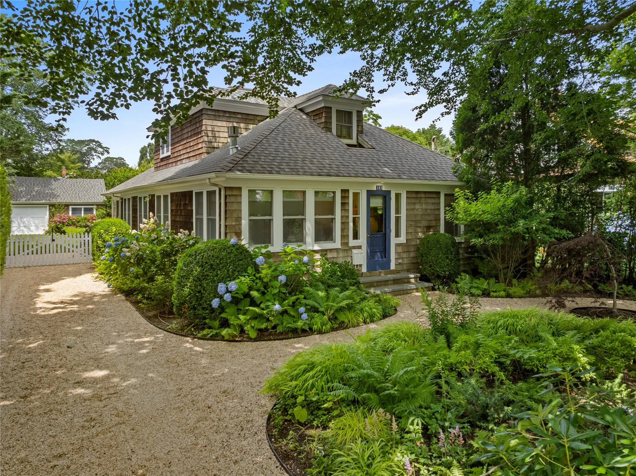 Shingle-style home with a shingled roof Shingle-style home with a shingled roof