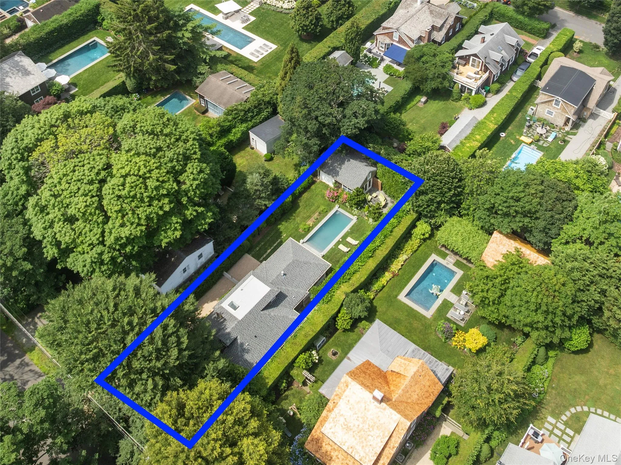 Aerial overview of property's location with nearby suburban area and property parcel outlined Aerial overview of property's location with nearby suburban area and property parcel outlined