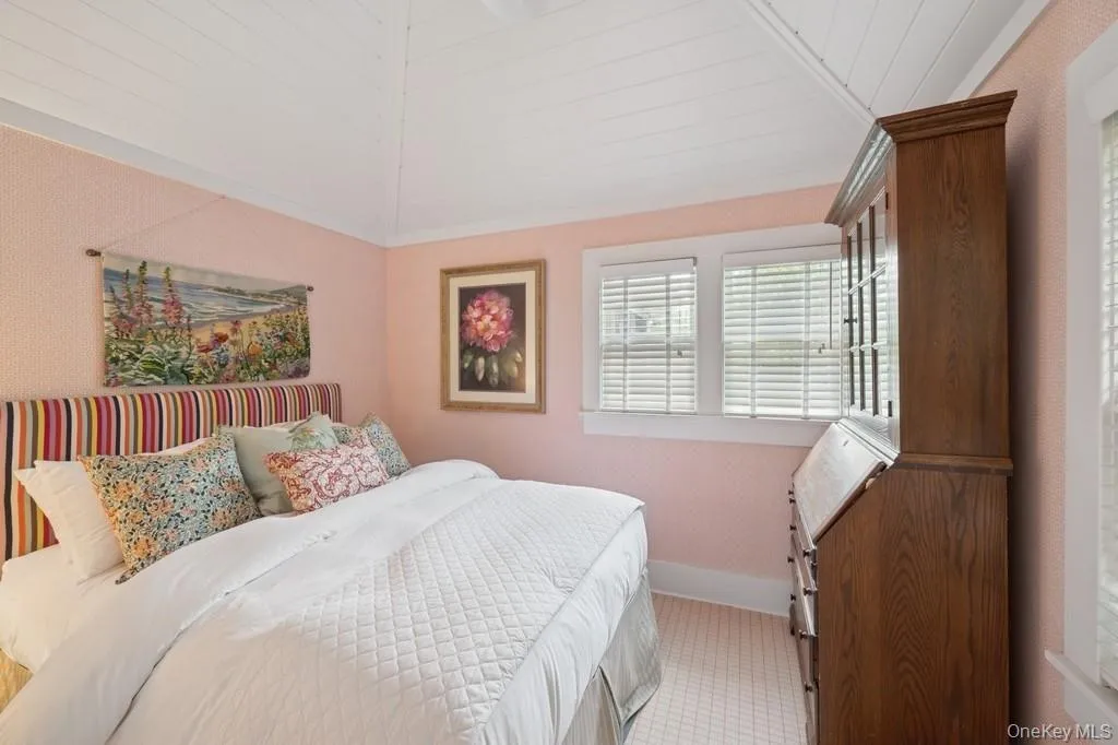 Bedroom with vaulted ceiling, wood ceiling, and light carpet Bedroom with vaulted ceiling, wood ceiling, and light carpet