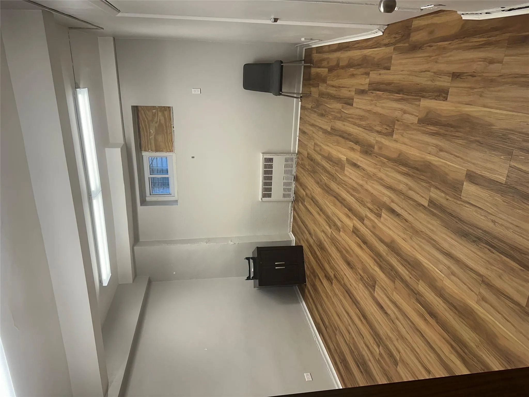 Finished basement featuring wood finished floors and baseboards Finished basement featuring wood finished floors and baseboards