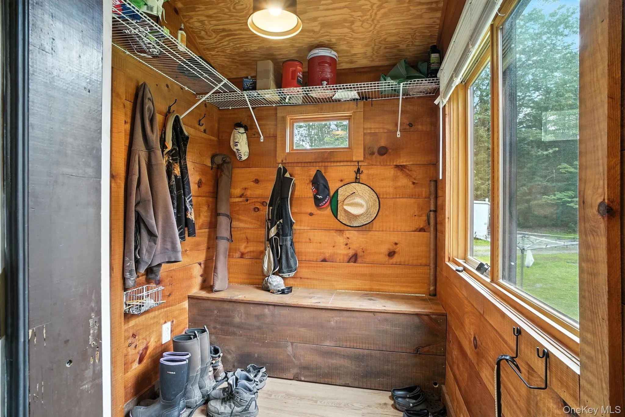 Mudroom with wood walls Mudroom with wood walls