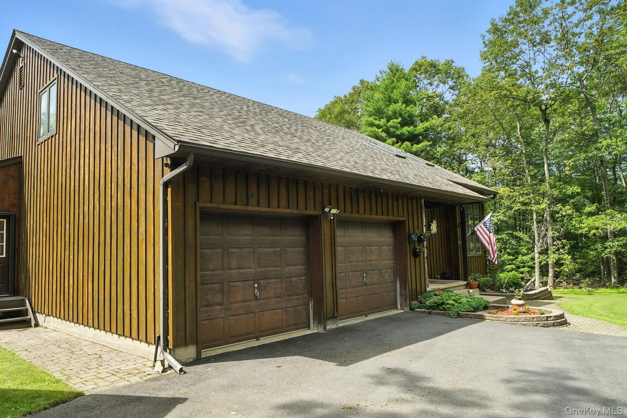Garage featuring driveway Garage featuring driveway