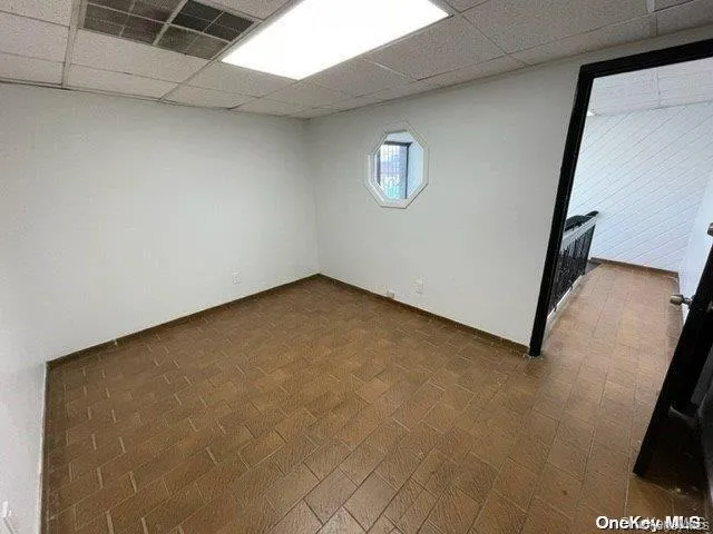 Below grade area with a paneled ceiling Below grade area with a paneled ceiling