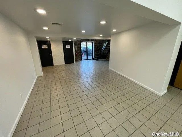 Spare room with recessed lighting and light tile patterned flooring Spare room with recessed lighting and light tile patterned flooring