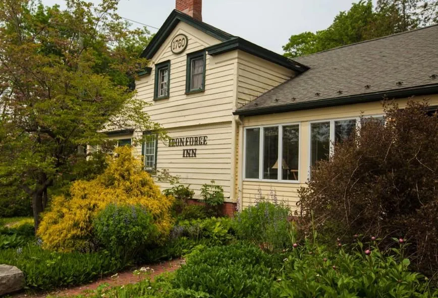View of side of property with a chimney and roof with shingles View of side of property with a chimney and roof with shingles