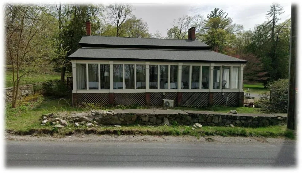 View of front facade with a sunroom, a chimney, and roof with shingles View of front facade with a sunroom, a chimney, and roof with shingles