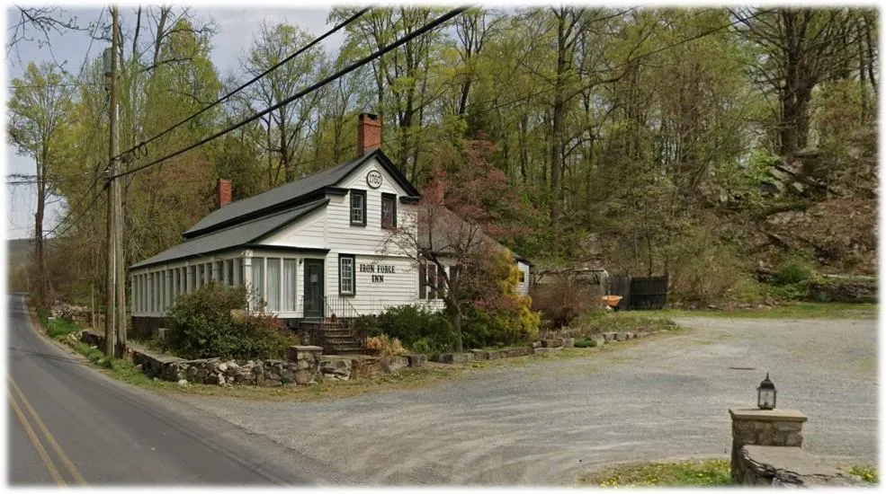 View of side of home with a chimney and dirt driveway View of side of home with a chimney and dirt driveway