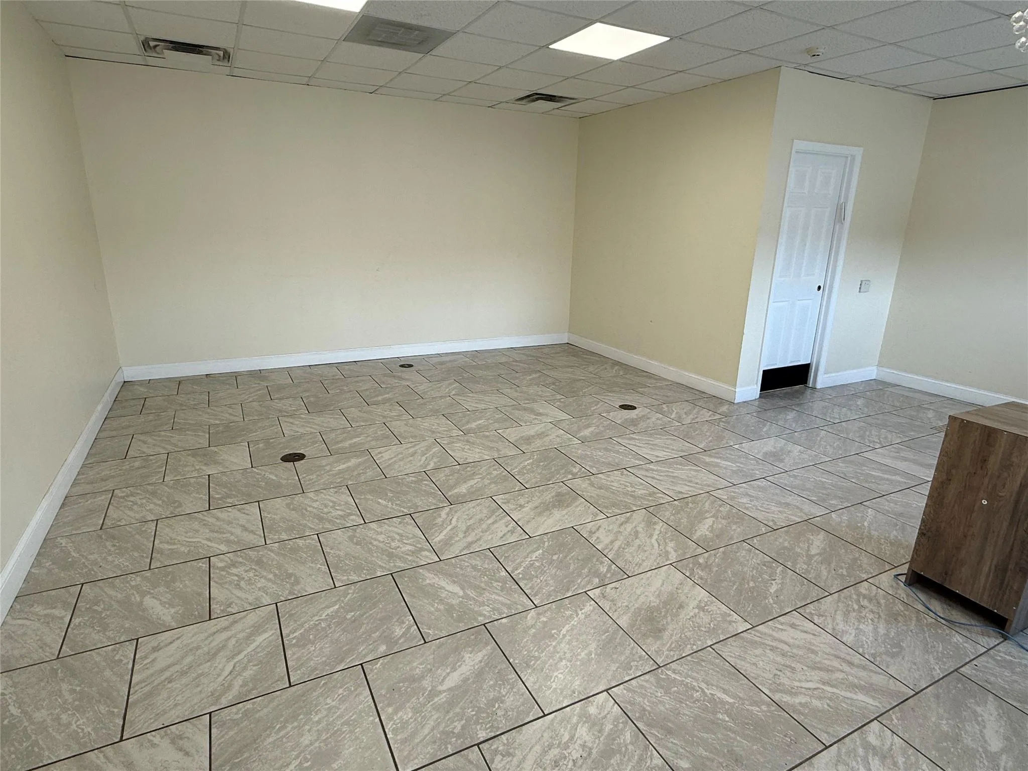 Spare room with a drop ceiling Spare room with a drop ceiling