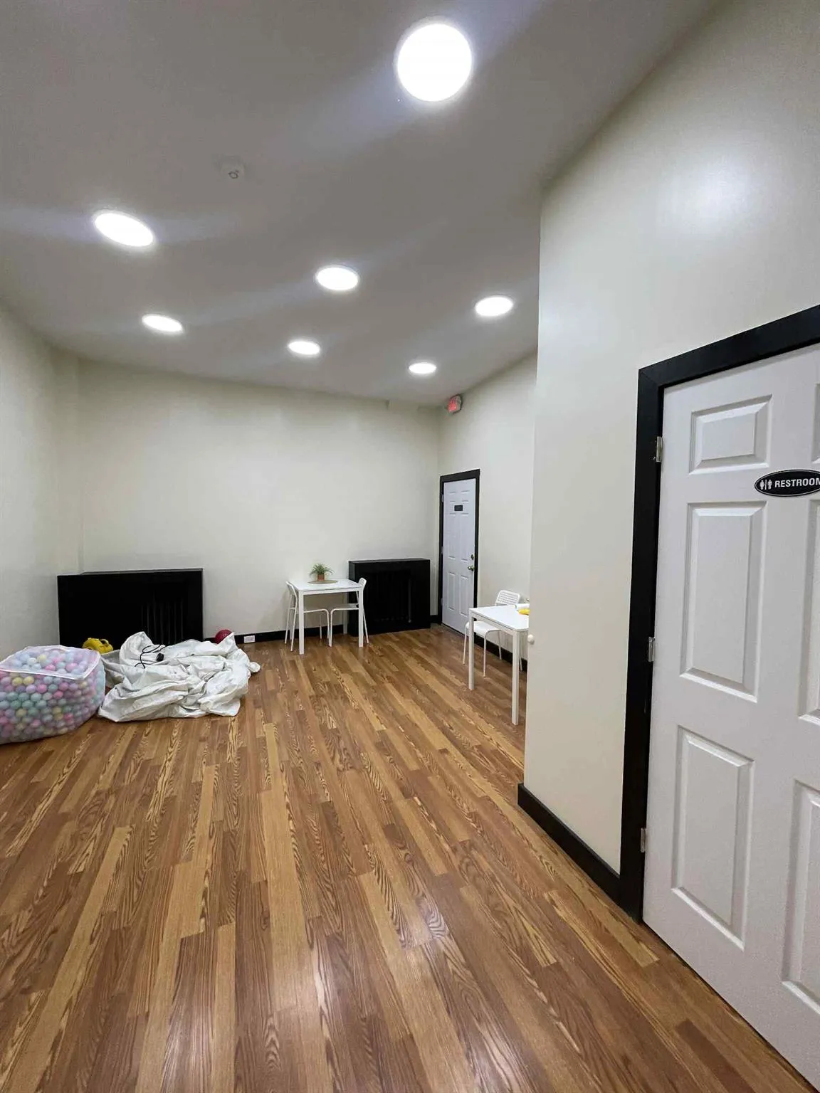 Misc room with wood finished floors and recessed lighting Misc room with wood finished floors and recessed lighting