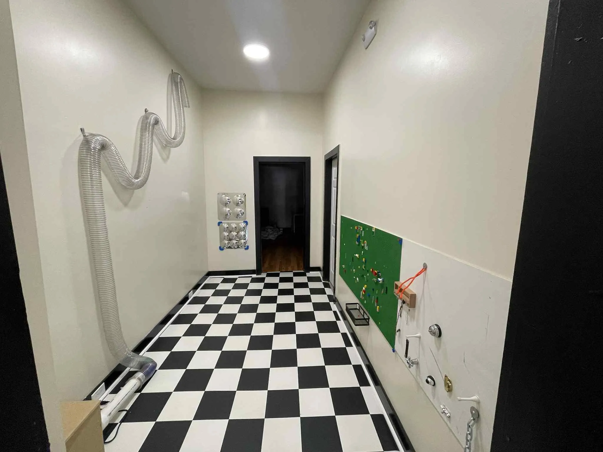 Hallway featuring tile patterned floors and recessed lighting Hallway featuring tile patterned floors and recessed lighting