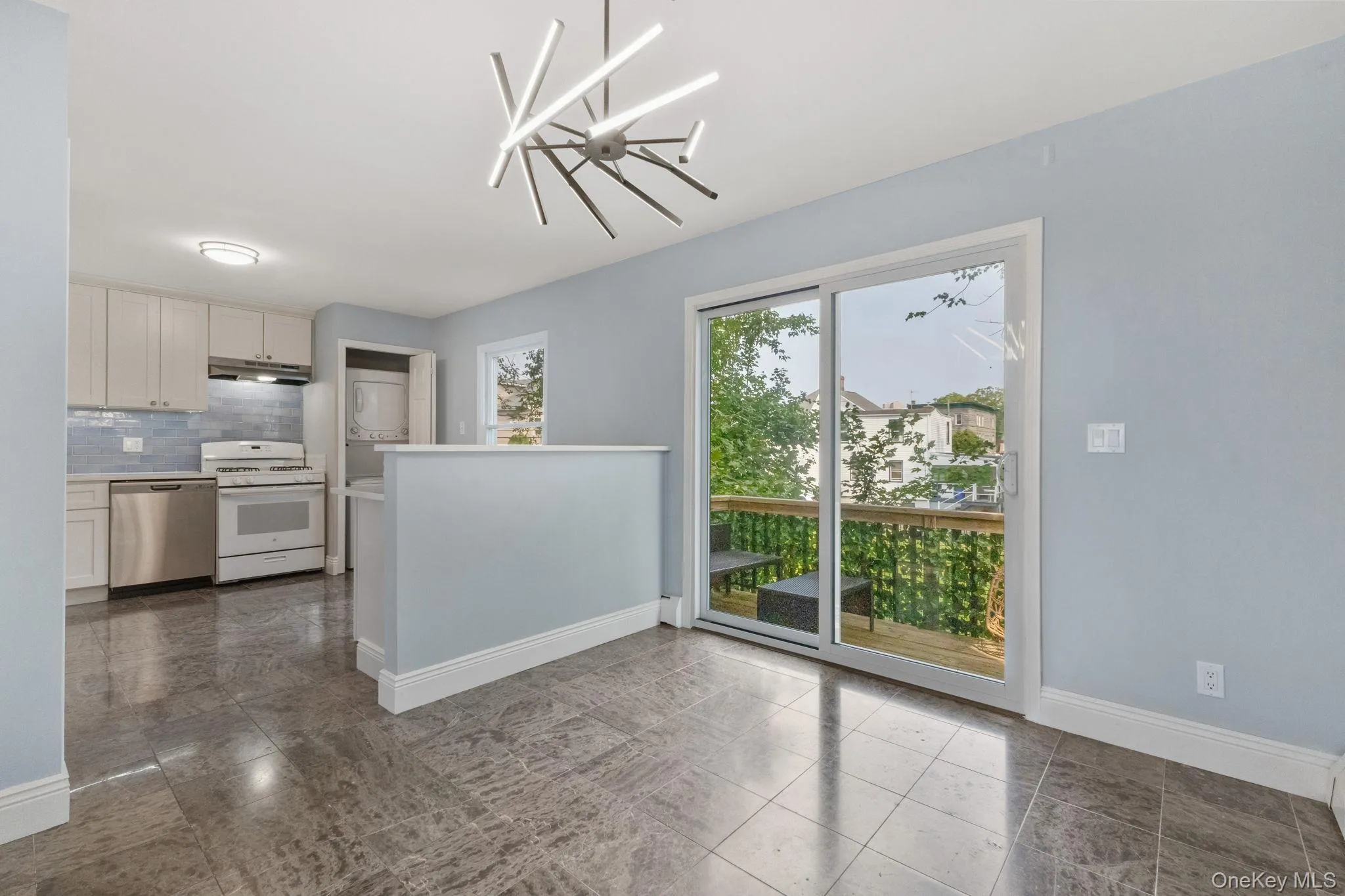 Kitchen and dining area featuring deck Kitchen and dining area featuring deck