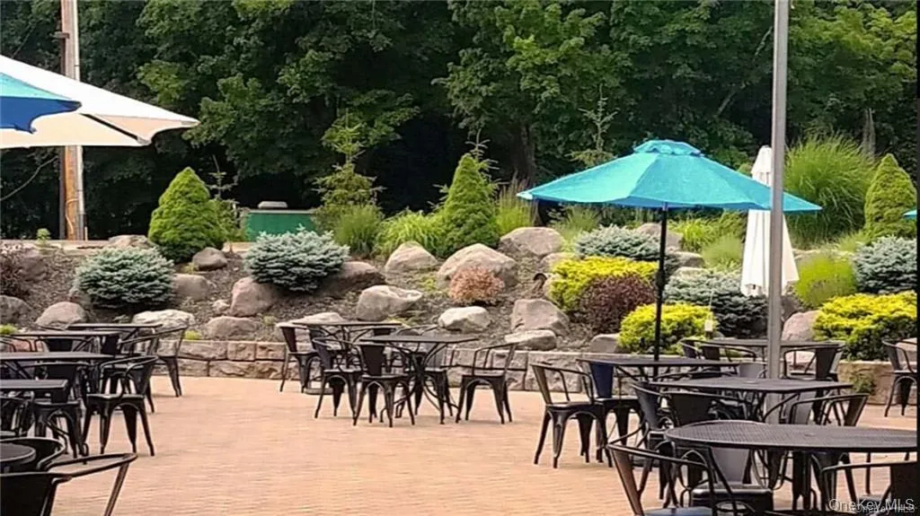 View of patio featuring outdoor dining area and a deck View of patio featuring outdoor dining area and a deck