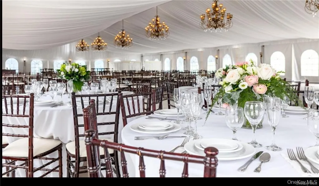 Dining space with a chandelier and plenty of natural light Dining space with a chandelier and plenty of natural light