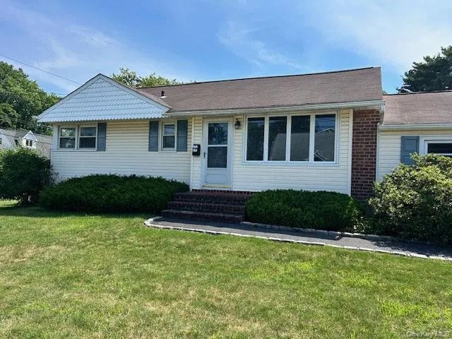 Single story home featuring entry steps and a front lawn Single story home featuring entry steps and a front lawn
