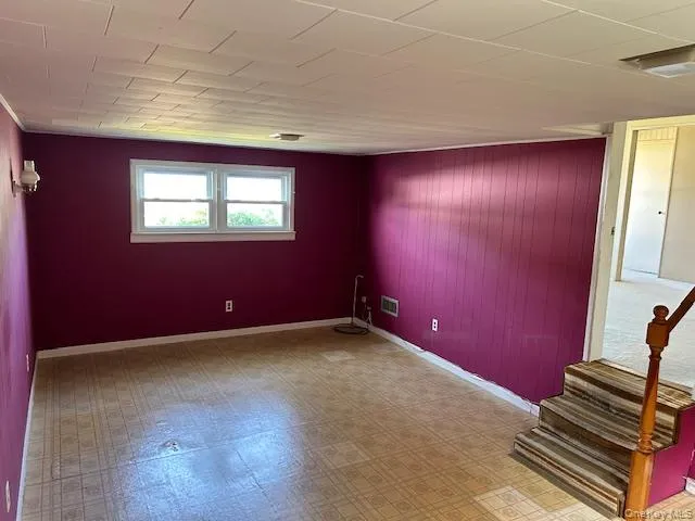 Spare room with stairs and wooden walls Spare room with stairs and wooden walls